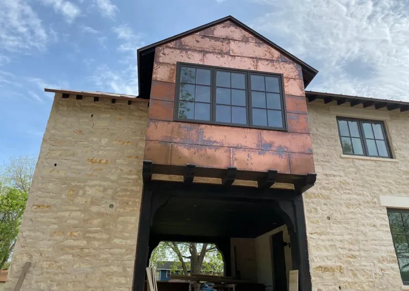 Copper metal panel facade on a stone building for Skylight Installation in Camp Hill